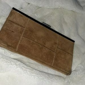 Caramel colored leather clutch